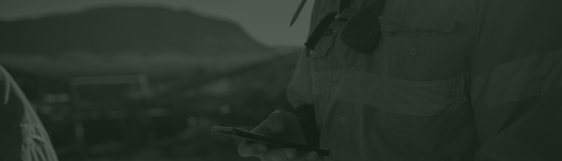 worker holding phone banner